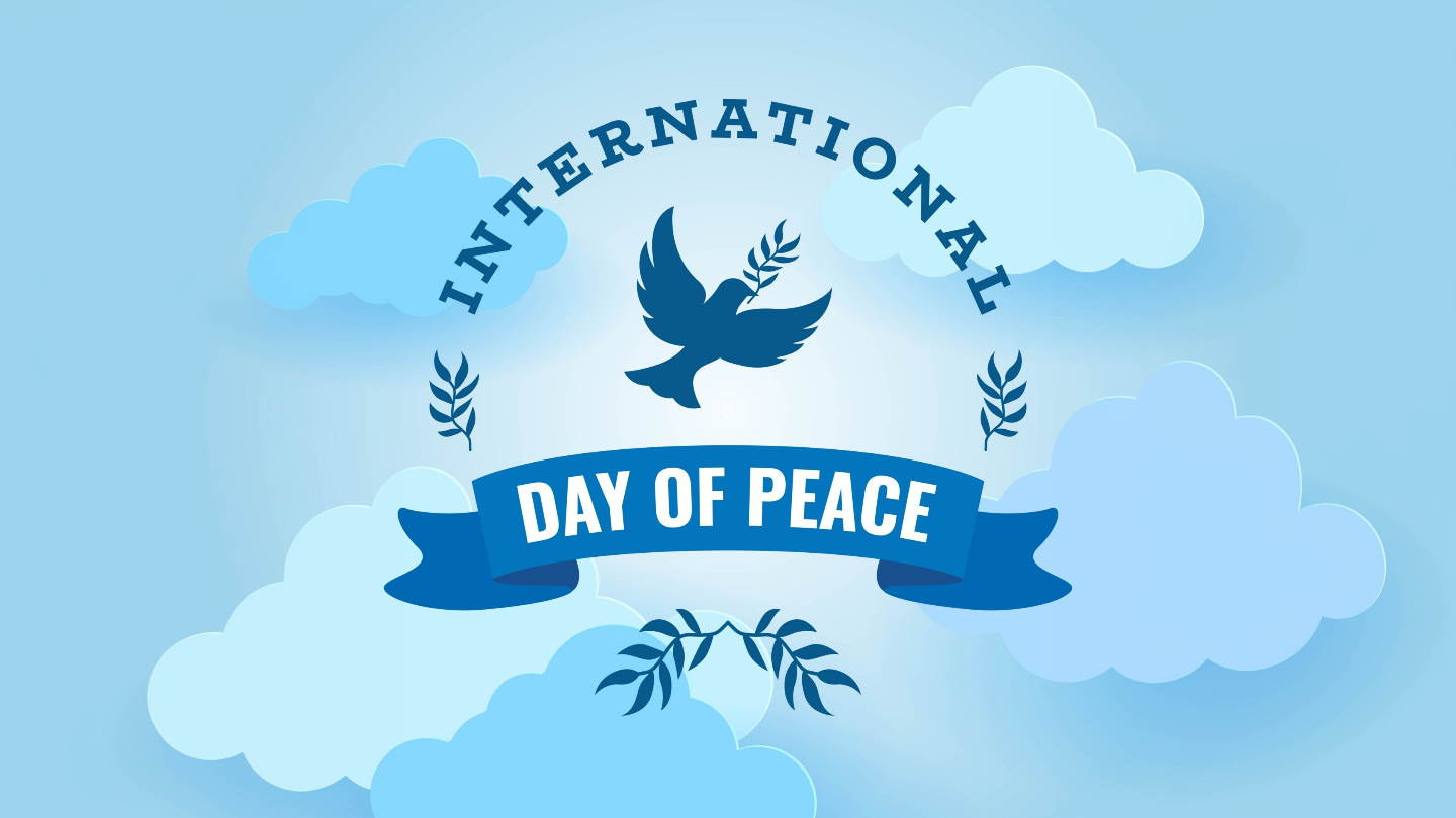 United Nations International Day of Peace - graphic with a dark blue logo on a pastel background of pale blue sky and blue-hued clouds