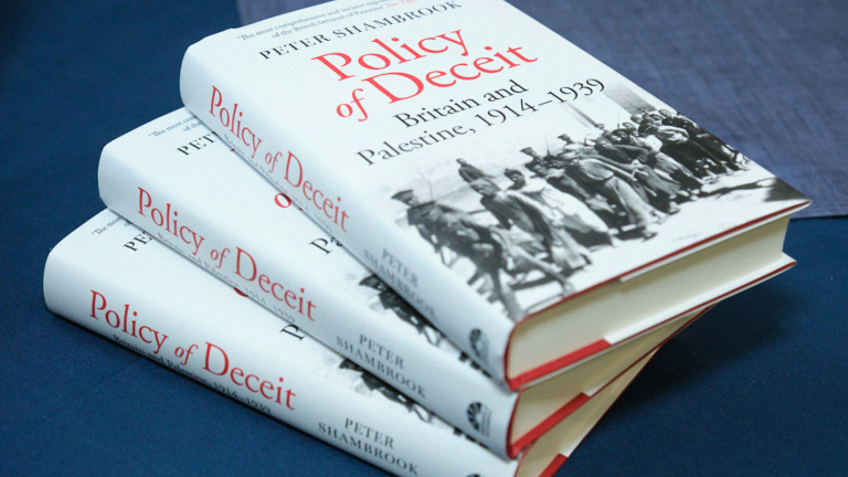 Policy of Deceit, stack of books
