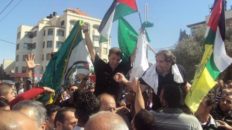 Nael Barghouti celebrates his freedom on October 18, 2011; photo: Hussein Shejaeya