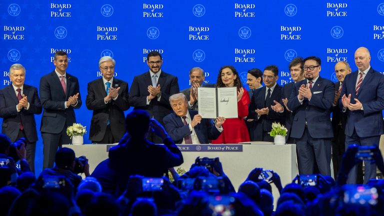 President Donald Trump holds the charter during a signing ceremony for his Board of Peace initiative at the World Economic Forum Annual Meeting 2026 in Davos-Klosters, Congress Centre, Switzerland, 22 January © World Economic Forum / Valeriano Di Domenico (CC BY-NC-SA 4.0, cropped from the original)