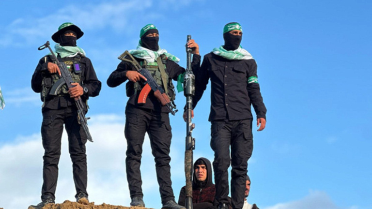 Hamas fighters during the handing over of the bodies of Israeli hostages to the Red Cross in Khan Younis, southern Gaza, 20 Feb 2025. (Doaa Albaz/Activestills)