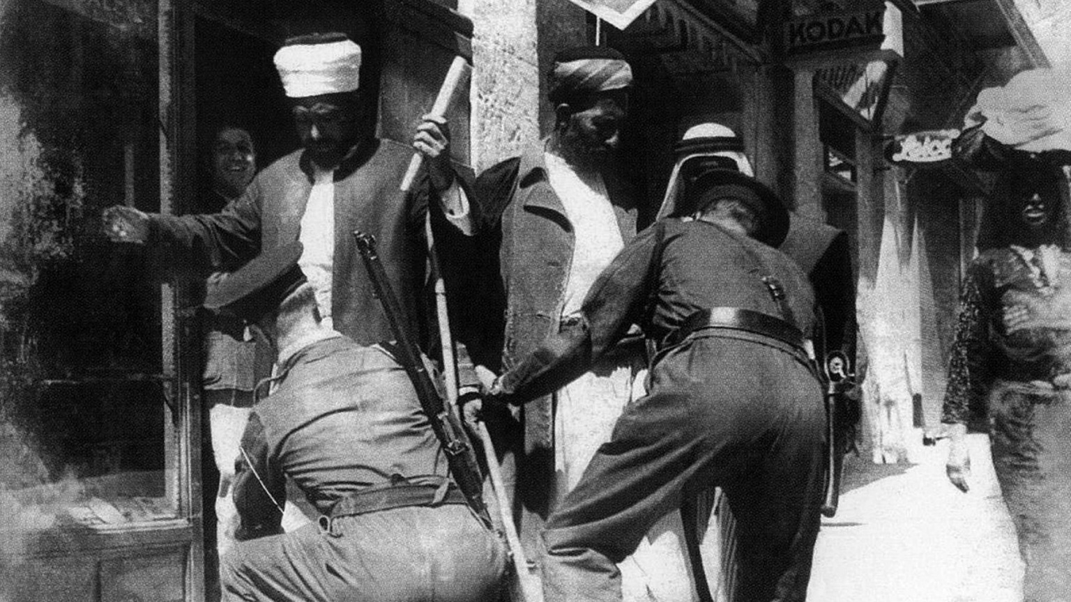 Palestinian Muslim elders searched in a Jerusalem street by Israeli forces – 1948 – 1536x864px Israeli forces searching Palestinians in a Jerusalem street in 1948
