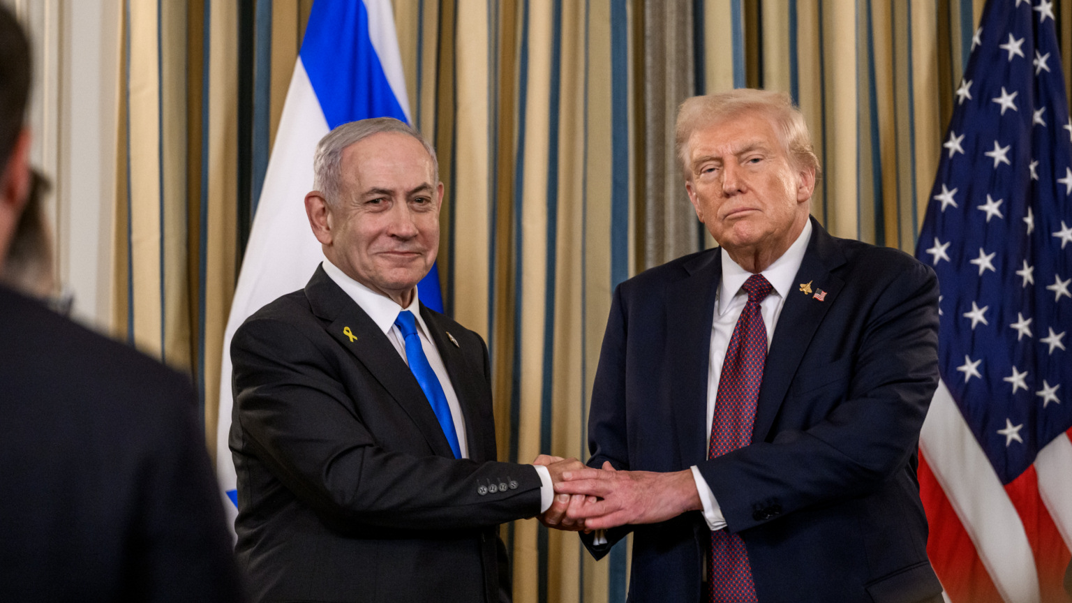Benjamin Netanyahu and Donald Trump shake hands after a joint press conference announcing the US peace plan for Gaza, 29 September 2025, in the State Dining Room of the White House. (Official White House Photo by Joyce N. Boghosian)