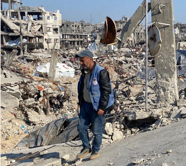 Sami at ruins of home